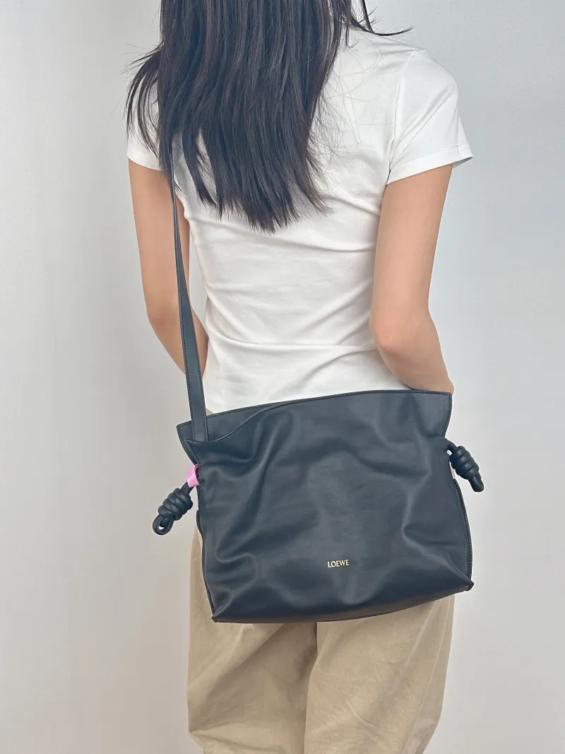 LOEWE Crossbody Bag Flamenco Black Calfskin Medium 30 × 10.5 × 24.5 cm — on-model view 1 of 2