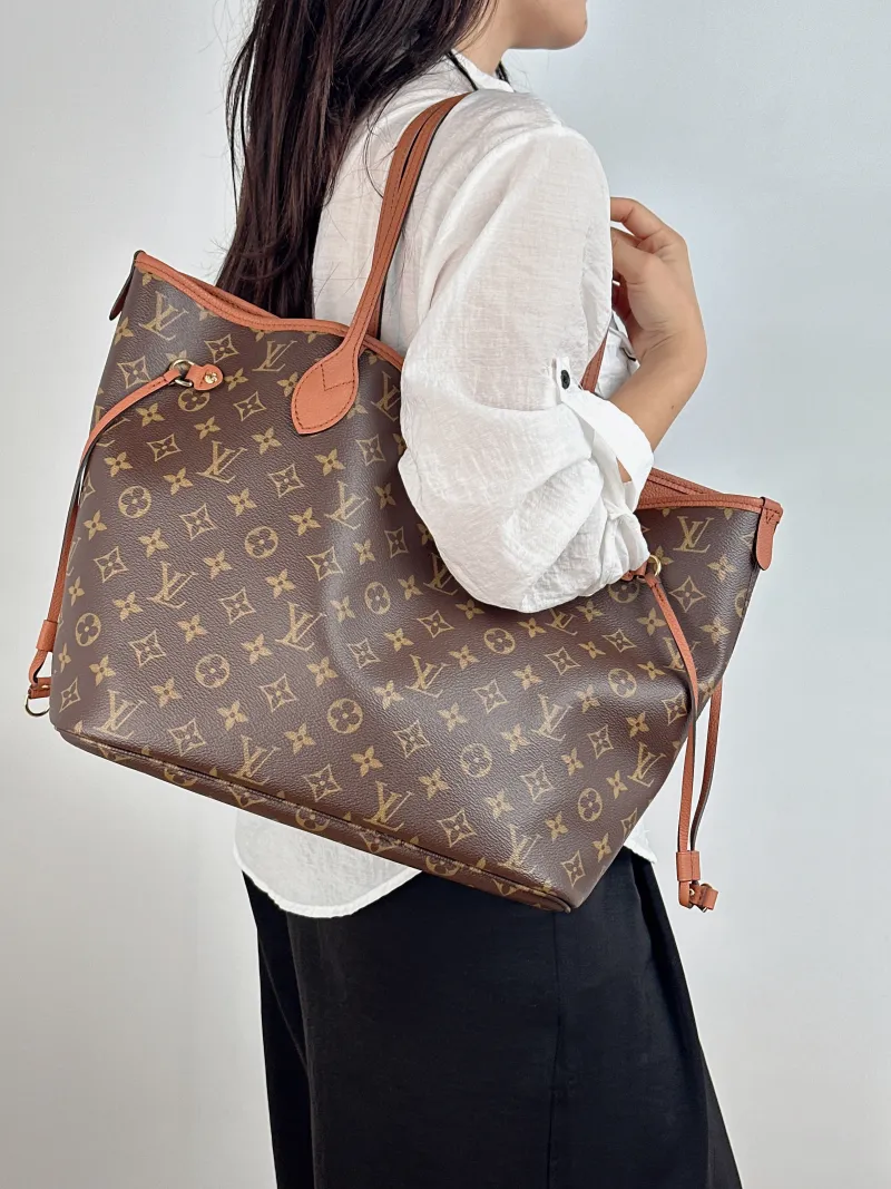Louis Vuitton Shoulder Bag NEVERFULL INSIDE OUT PVC · Calfskin Medium 31 × 14 × 28 cm — on-model view 1 of 2