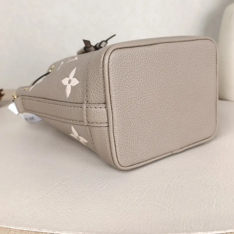 Louis Vuitton Crossbody Bag NANO NOÉ Bucket Bag Nano · White Monogram Empreinte Embossed Calfskin nano 13 × 10 × 16 cm — detail view 10 of 11