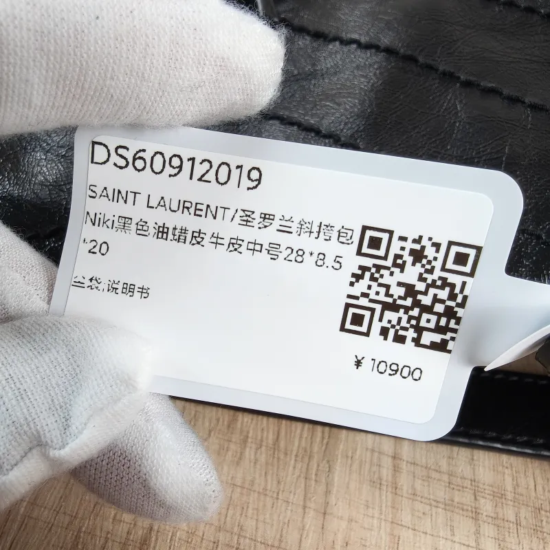 SAINT LAURENT Crossbody Bag Niki Black Waxed Leather Calfskin Medium28 × 8.5 × 20 cm — detail view 1 of 13