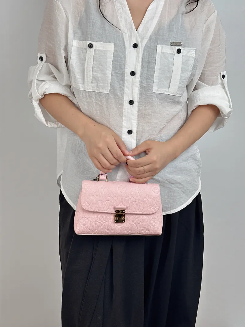 Louis Vuitton Crossbody Bag MADELEINE Pink Calfskin nano 21 × 6 × 12.5 cm — on-model view 1 of 2