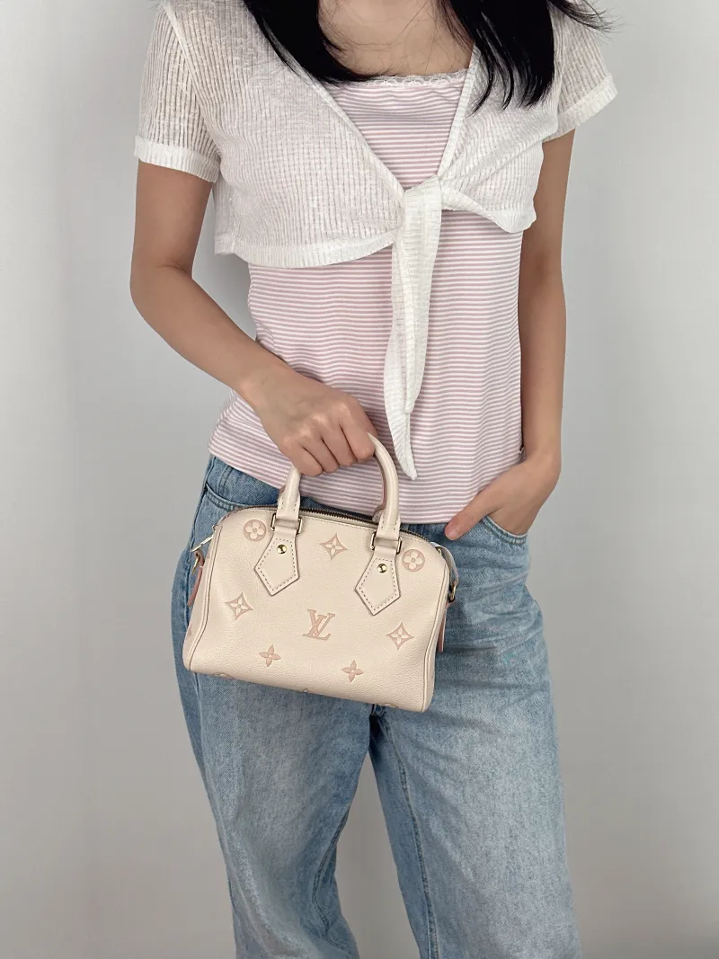 Louis Vuitton Crossbody Bag Speedy20Beige · Pink Empreinte Embossed Calfskin Small20.5 × 12 × 13.5 cm — on-model view 1 of 3