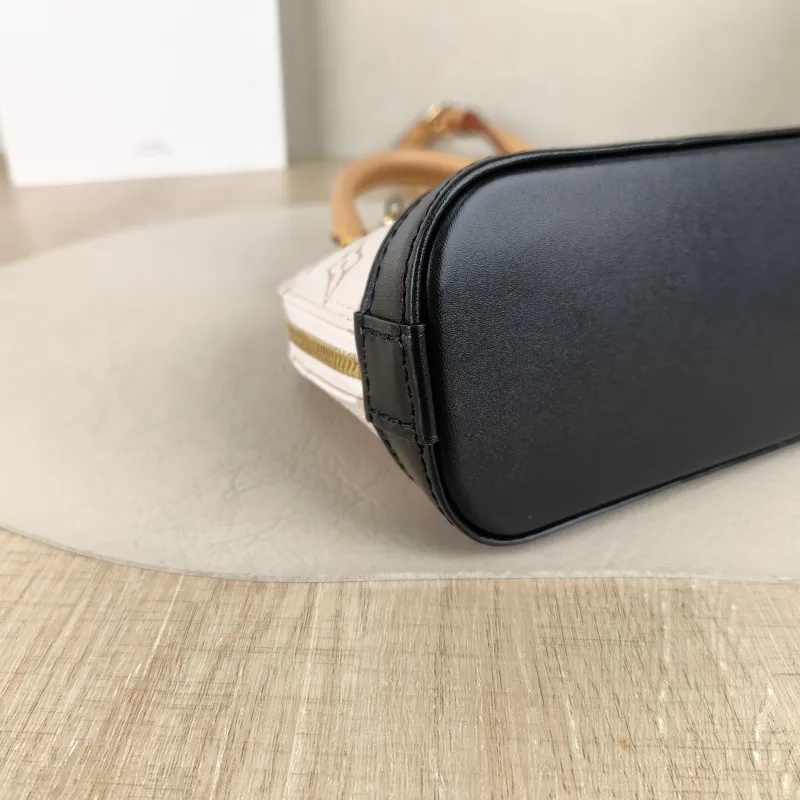 Louis Vuitton Crossbody Bag Alma Nano · Black PVC nano 18 × 8 × 12 cm — detail view 9 of 9