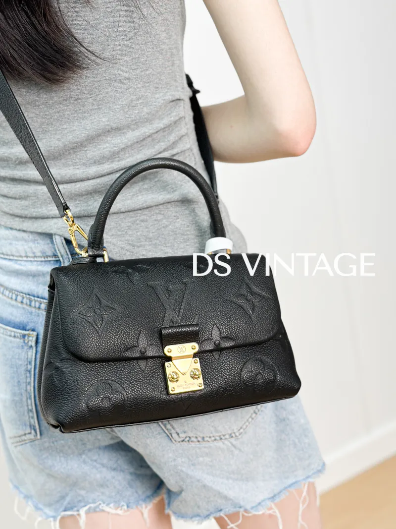 Louis Vuitton Crossbody Bag MADELEINE Black Empreinte Embossed Calfskin BB 24 × 8.5 × 17 cm — on-model view 3 of 3