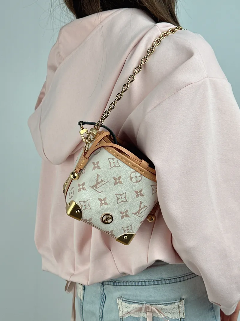 Louis Vuitton Crossbody Bag NOÉ PURSE LV CHARMS PVC Mini 11.5 × 11.5 × 11.5 cm — on-model view 2 of 2