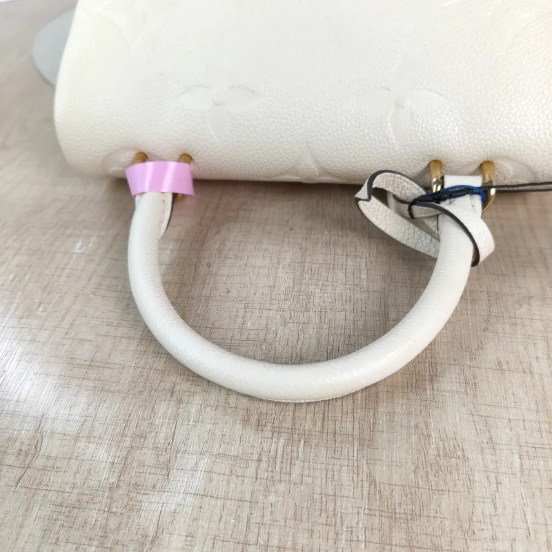 Louis Vuitton Crossbody Bag MADELEINE Beige Monogram Empreinte Embossed Calfskin BB 24 × 8.5 × 17 cm — detail view 9 of 12