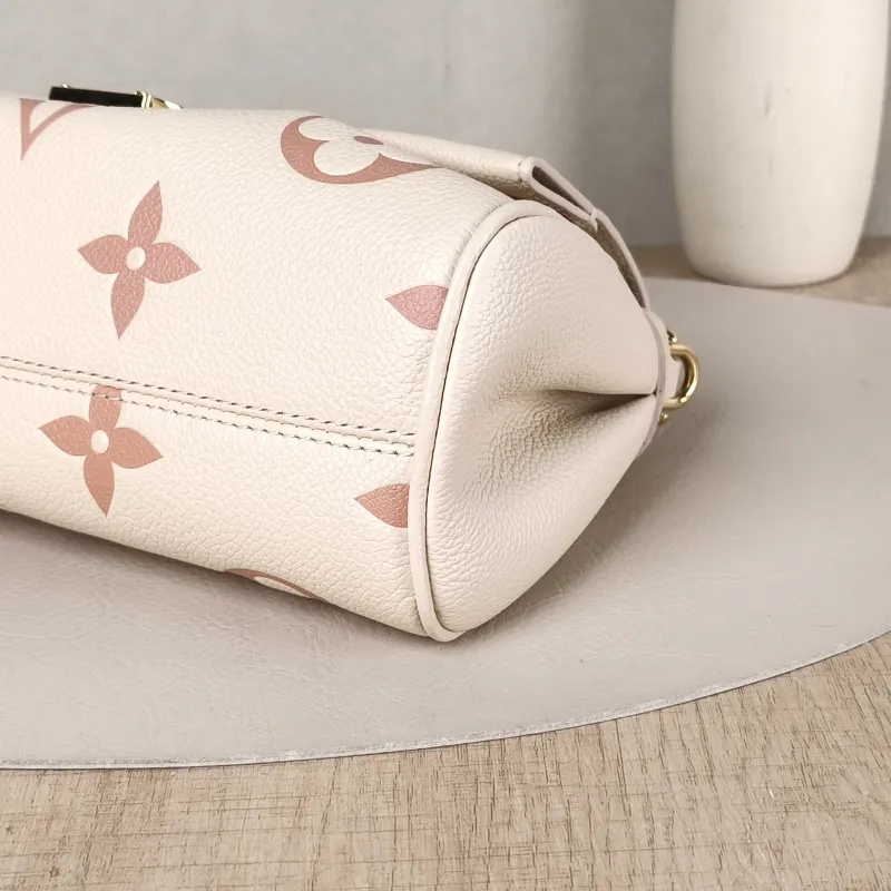 Louis Vuitton Crossbody Bag Favorite White · Pink Empreinte Embossed Calfskin Monogram Medium24 × 9 × 14 cm — detail view 12 of 12