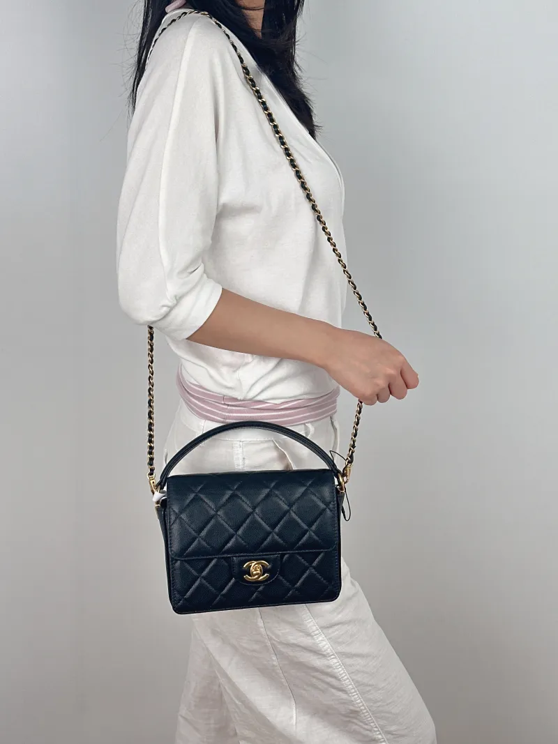 Chanel Crossbody Bag Black with Gold-Tone Hardware Grained Calfskin Small 20 × 5 × 15 cm — on-model view 1 of 3