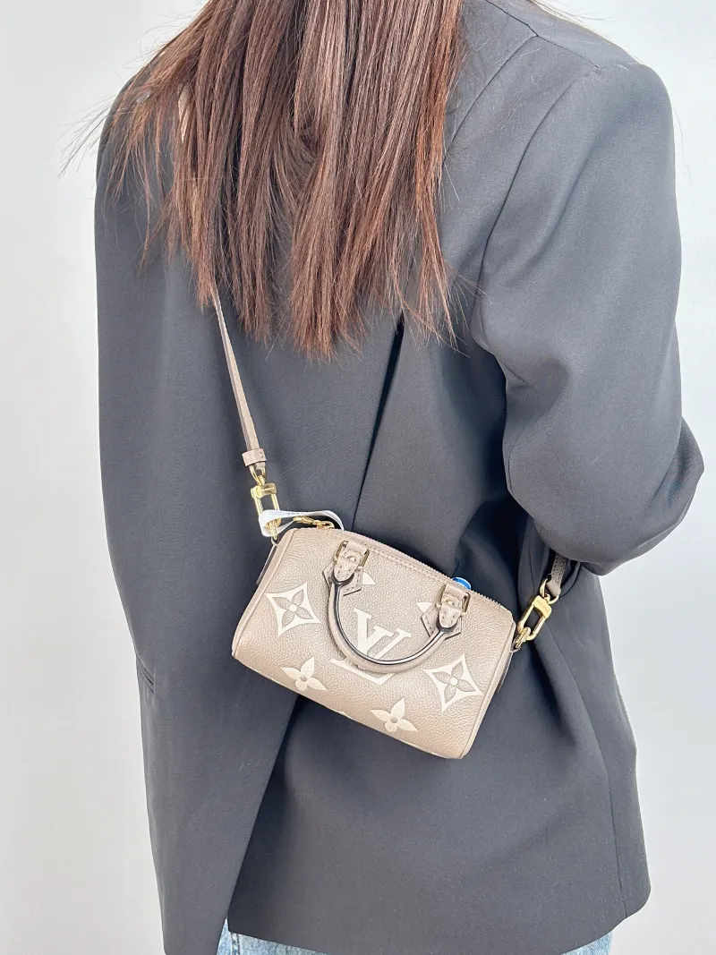 Louis Vuitton Crossbody Bag Speedy Nano · White Monogram Empreinte Embossed Calfskin nano 16 × 7.5 × 10 cm — on-model view 3 of 3