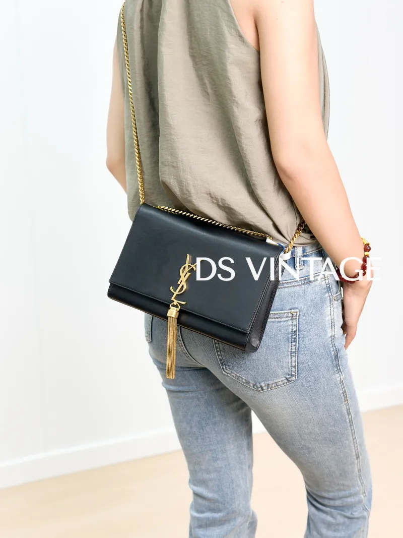 SAINT LAURENT Crossbody Bag KATE Edition Black Calfskin Medium 24 × 5.5 × 14.5 cm — on-model view 1 of 3
