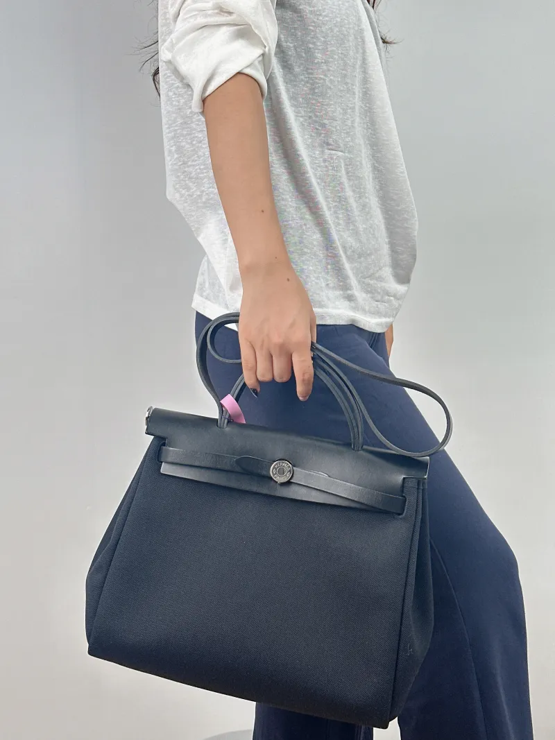 Hermès Shoulder Bag Herbag 31 Black Canvas Medium 31 × 10 × 25 cm z — on-model view 2 of 2