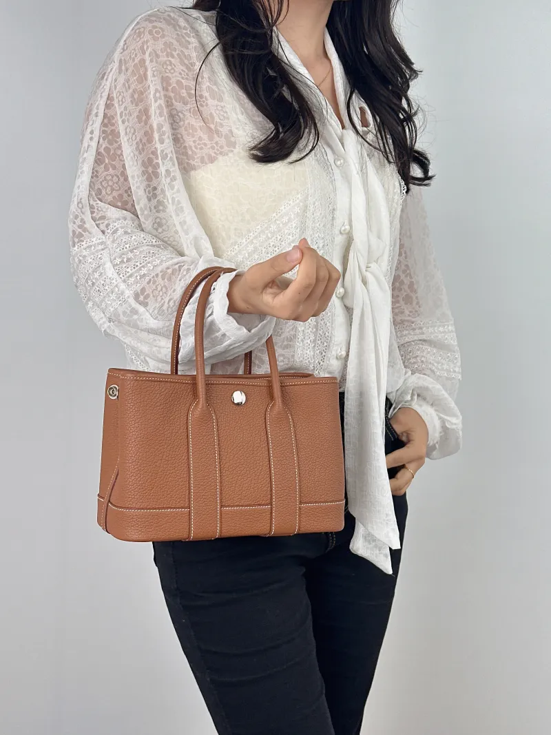 Hermès Top Handle Bag Neo Garden 23 Mini Negonda Calfskin Mini 23 × 10 × 16 cm W — on-model view 2 of 2