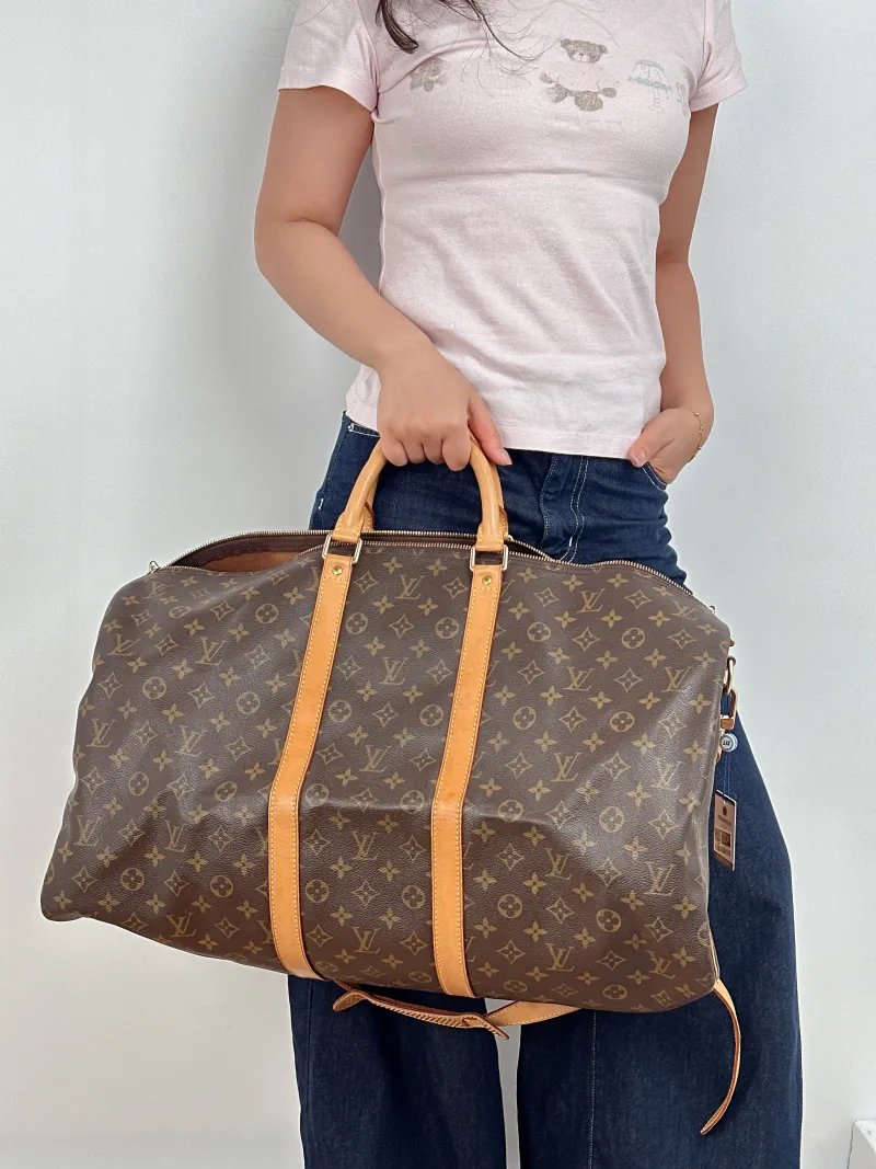 Louis Vuitton Crossbody Bag Keepall 55 Shoulder Strap Edition Monogram PVC One Size 55 × 26 × 31 cm — on-model view 1 of 2