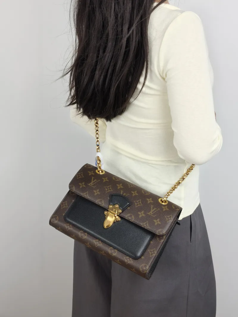 Louis Vuitton Crossbody Bag VICTOIRE Monogram PVC 27 × 10 × 17 cm — on-model view 1 of 2