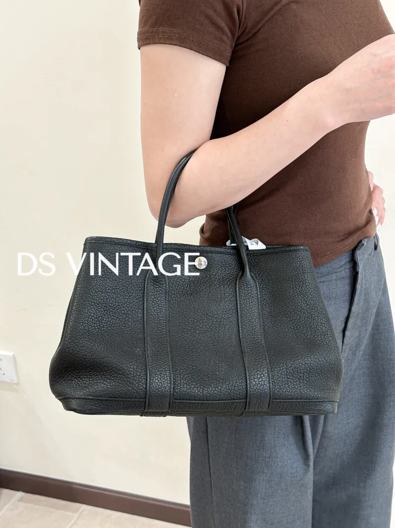 Hermès Top Handle Bag Garden Party 30 30Black Negonda Calfskin Medium30 × 13 × 21 cm — on-model view 1 of 3