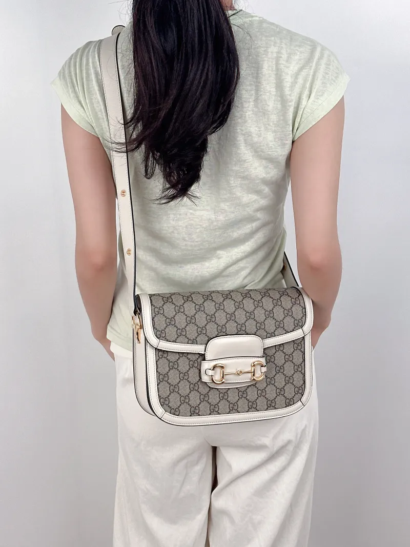 GUCCI Crossbody Bag Horsebit 1955 Horsebit Medium White Monogram PVC Medium25 × 8 × 18 cm — on-model view 2 of 3