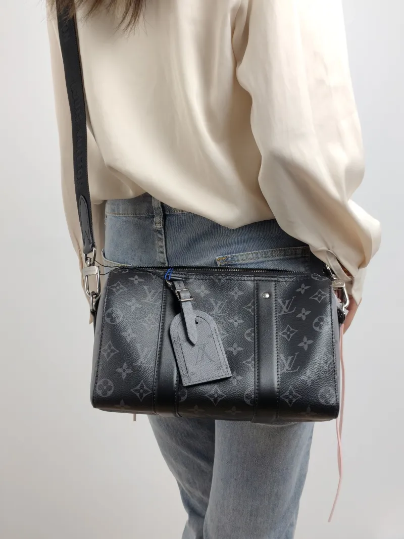 Louis Vuitton Crossbody Bag City Keepall Black PVC Medium 27 × 13 × 17 cm — on-model view 2 of 2