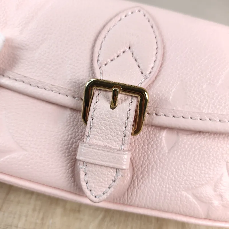 Louis Vuitton Crossbody Bag Diane Baguette Bag Monogram Empreinte Embossed Calfskin nano 19 × 6 × 10.5 cm — detail view 1 of 13