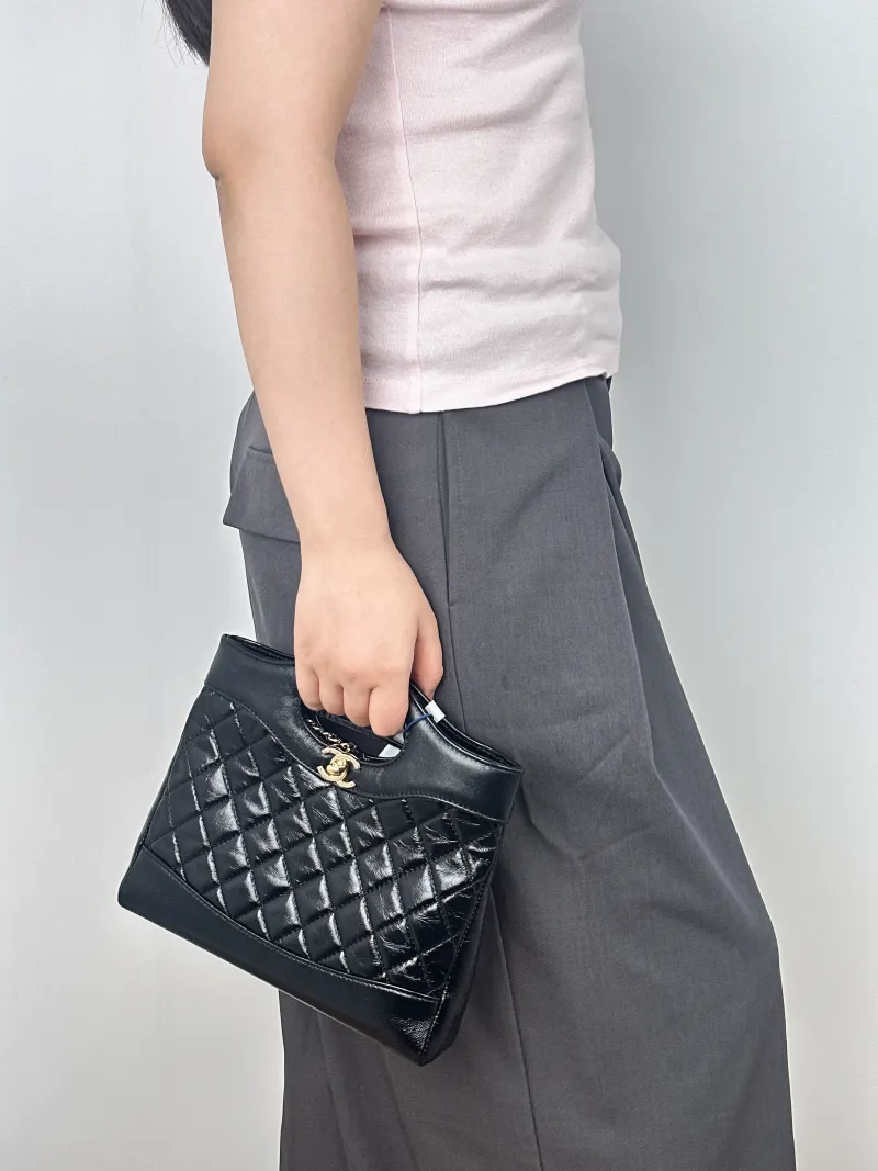 Chanel Crossbody Bag31Bag Black Waxed Leathermini23 × 5.5 × 22 cm — on-model view 1 of 2