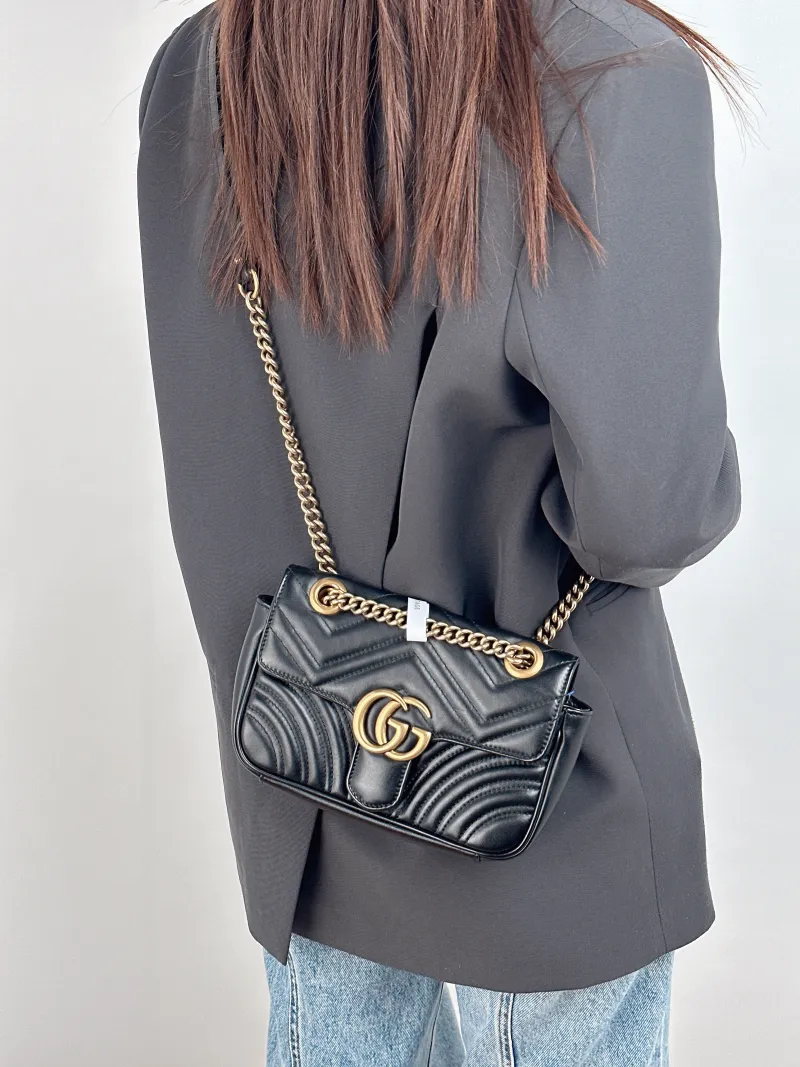 GUCCI Crossbody Bag GG Marmont Small Marmont 22 Black CC alfskin Small 22 × 6 × 13 cm — on-model view 1 of 2
