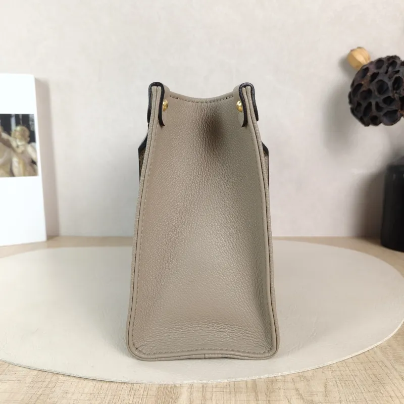 Louis Vuitton Shoulder Bag Onthego · White Monogram Empreinte Embossed Calfskin Small 25 × 11.5 × 19 cm — detail view 9 of 10