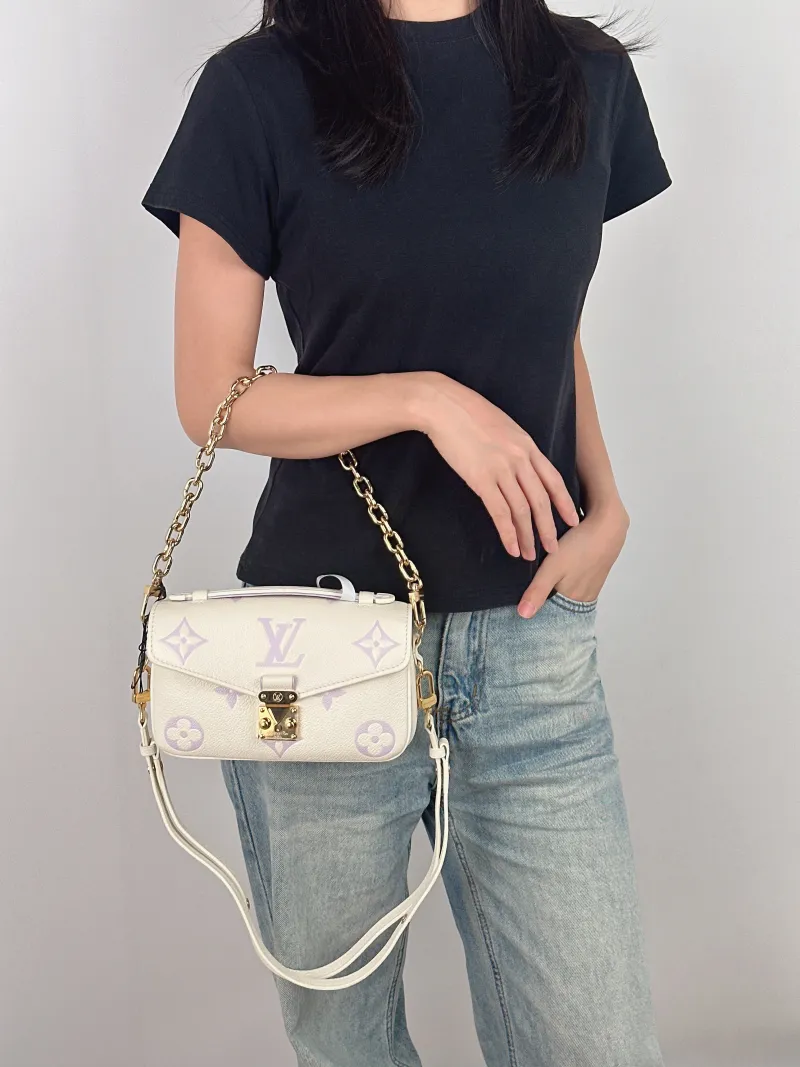 Louis Vuitton Crossbody Bag Pochette Métis East West White · Monogram Empreinte Embossed Calfskin Small 21.5 × 6 × 13.5 cm — on-model view 2 of 4