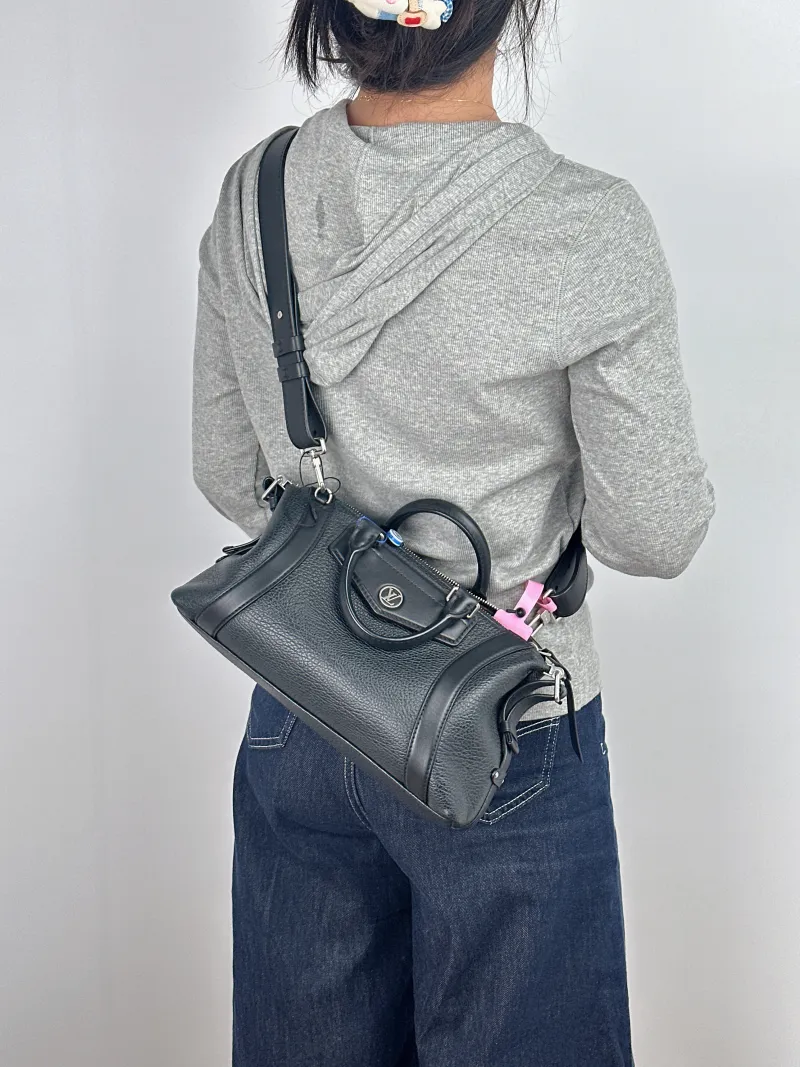 Louis Vuitton Top Handle Bag BIKER Black Lambskin Small 30 × 12 × 12 cm — on-model view 1 of 2