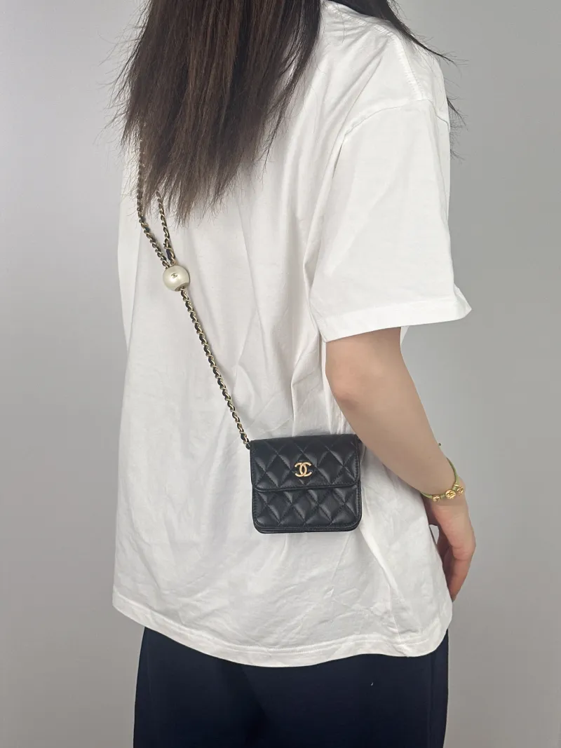 Chanel Crossbody Bag Crossbody Bag Black with Gold-Tone Hardware Lambskinmini12 × 2.5 × 9.5 cm — on-model view 2 of 2