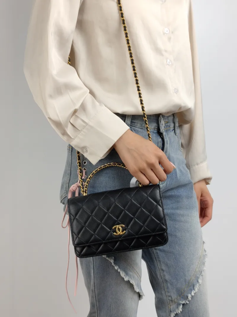 Chanel Crossbody Bag woc Black Lambskin Mini 19.2 × 3.5 × 12.3 cm — on-model view 1 of 3