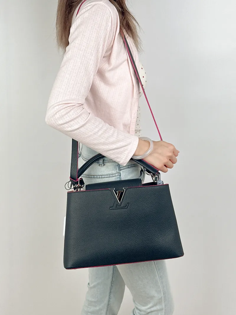 Louis Vuitton Top Handle Bag Capucines Black Calfskin Medium31.5 × 11 × 20 cm — on-model view 2 of 3
