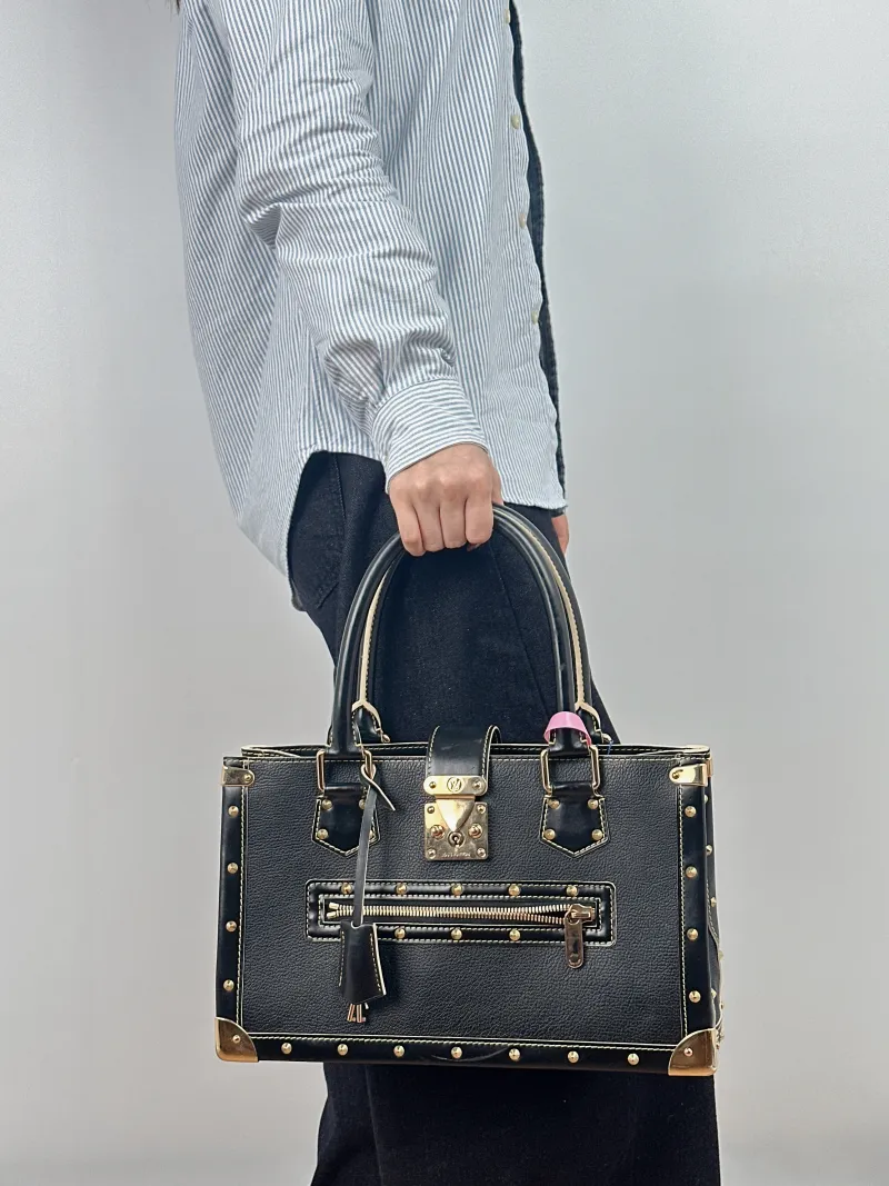 Louis Vuitton Top Handle Bag Suhali Vintage Black Lambskin One Size 36 × 12 × 22 cm — on-model view 1 of 2