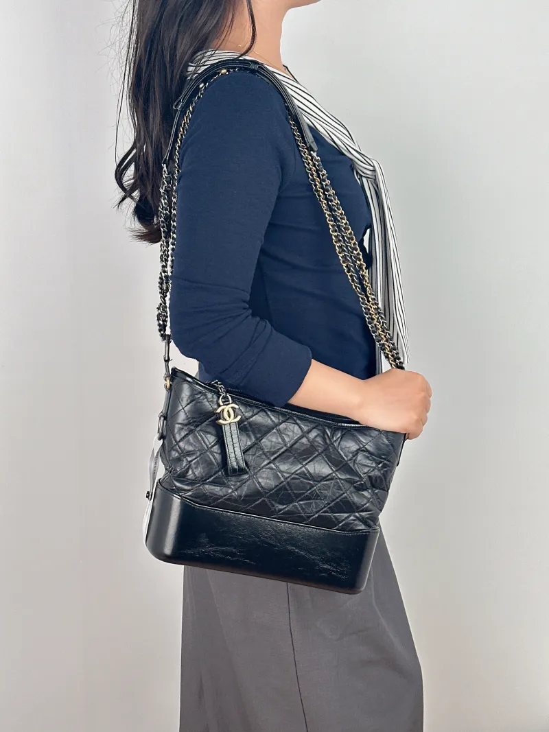 Chanel Crossbody Bag Gabrielle Gabrielle Bag Black CC alfskin Large28 × 10 × 23 cm — on-model view 1 of 2