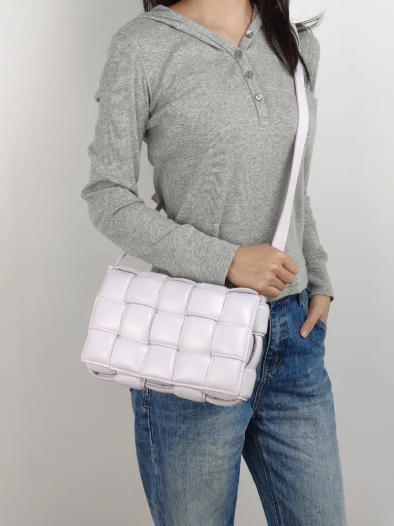 Bottega Veneta Crossbody Bag Padded Cassette Woven Lambskin Medium 26 × 8 × 18 cm — on-model view 1 of 2