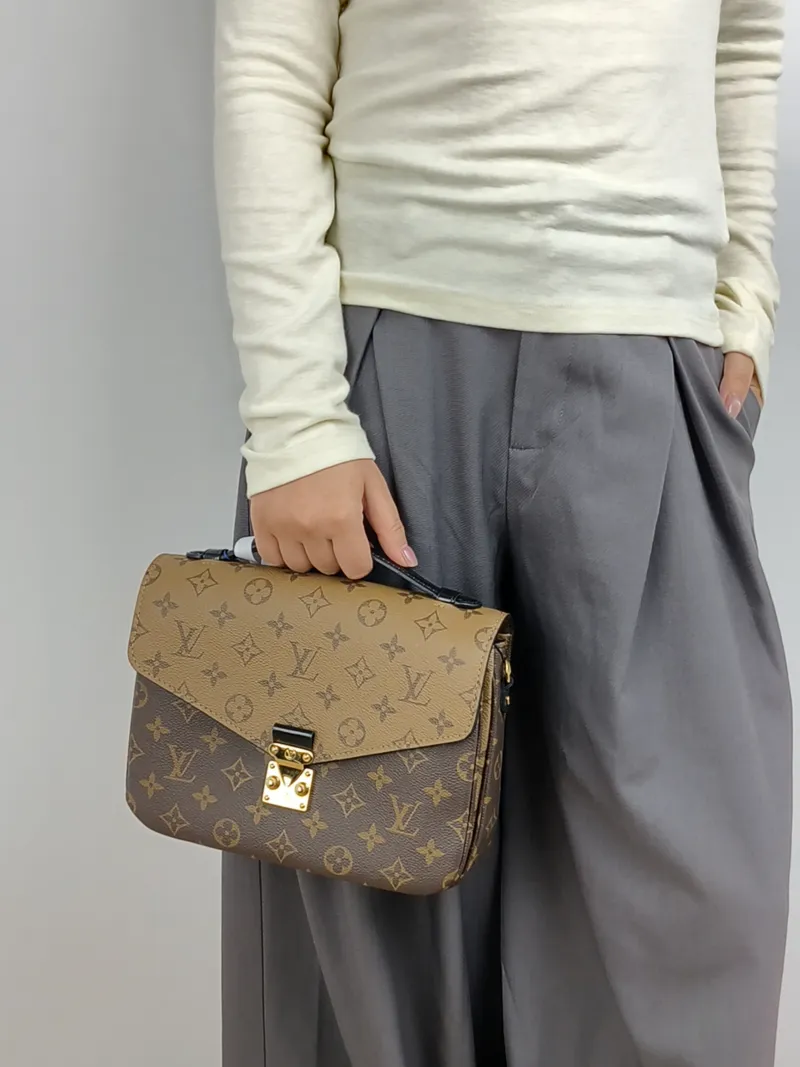 Louis Vuitton Crossbody Bag Pochette Métis Monogram Colorblock PVC Medium 25 × 7 × 19 cm — on-model view 3 of 3