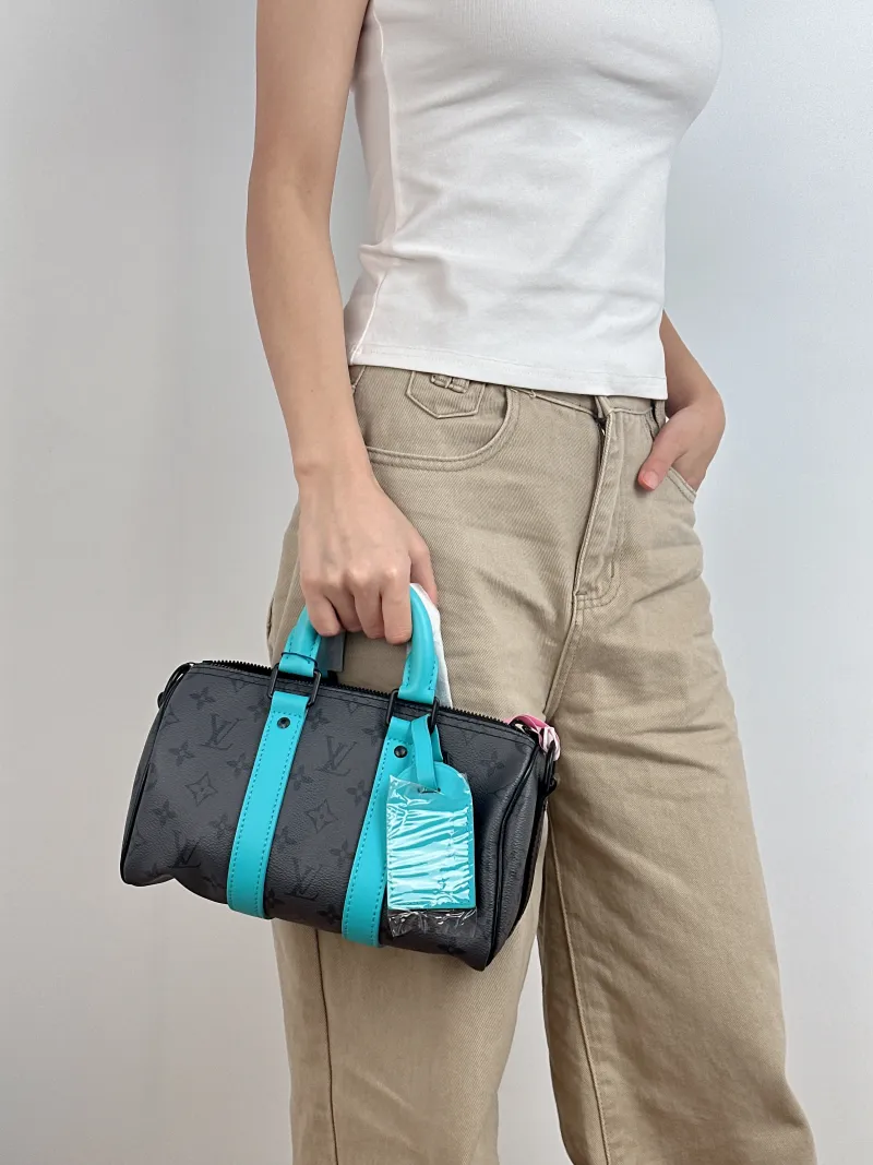 Louis Vuitton Crossbody Bag Keepall 25 Black · Blue PVC Medium 25 × 11 × 15 cm — on-model view 1 of 3