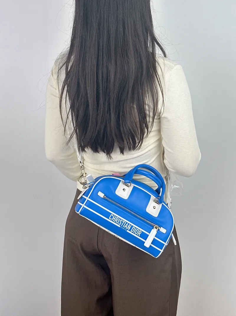 DIOR Top Handle Bag Vibe Bowling Calfskin Small 24.5 × 11.5 × 14.5 cm — on-model view 1 of 2