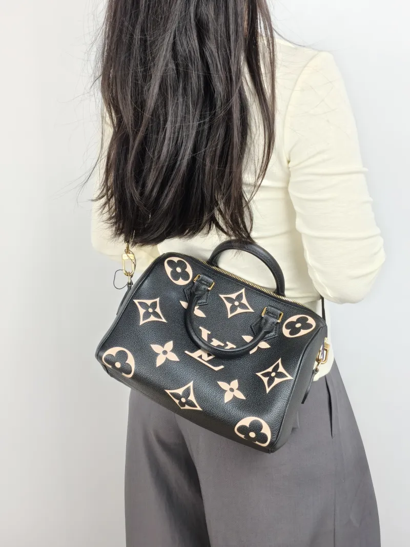 Louis Vuitton Crossbody Bag Speedy25 Black · White Monogram Empreinte Embossed Calfskin Medium 25 × 15 × 19 cm — on-model view 2 of 3
