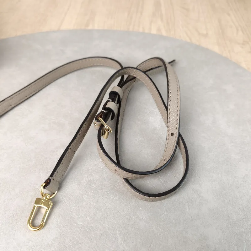 Louis Vuitton Crossbody Bag Onthego BB · White Monogram Empreinte Embossed Calfskin BB 18 × 8.5 × 15 cm — detail view 7 of 11