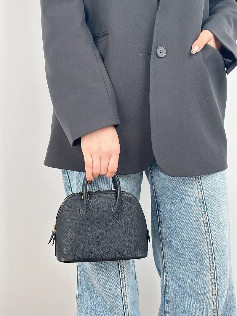 Hermès Crossbody Bag Bolide 1923 Top Handle Bag Black Lambskin Mini 18 × 8 × 15 cm K — on-model view 1 of 2