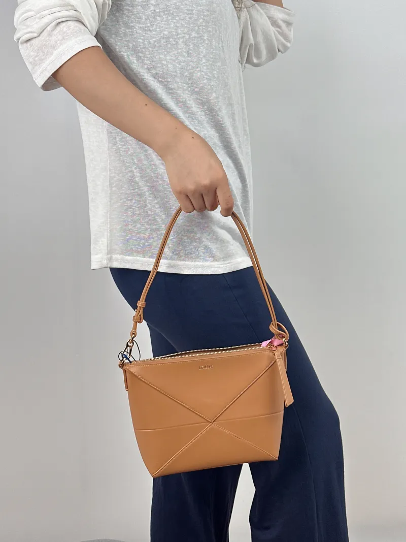 LOEWE Shoulder Bag puzzle fold Shoulder Bag Brown Calfskin One Size 23 × 6.5 × 15.5 cm — on-model view 1 of 2