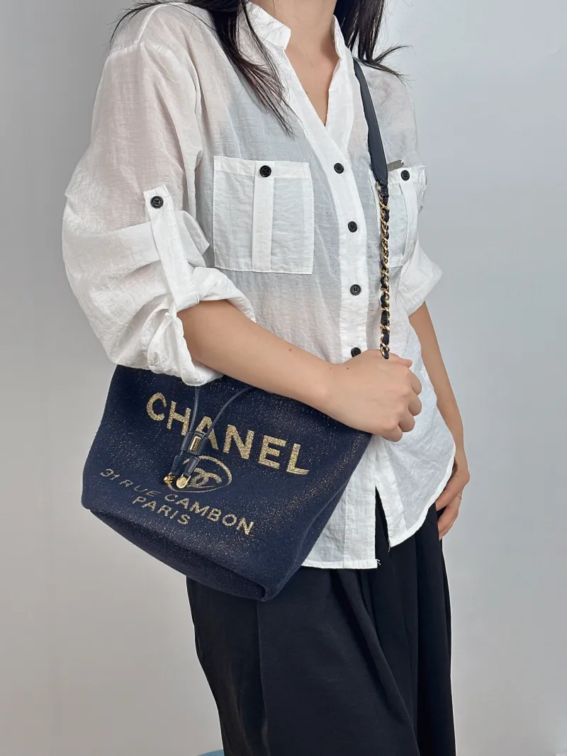 Chanel Shoulder Bag Bucket Bag Navy Gold Canvas 20 × 15 × 25 cm 28 — on-model view 1 of 2
