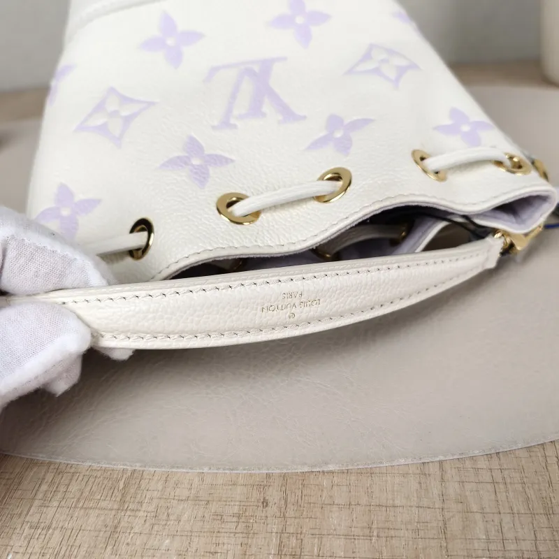 Louis Vuitton Crossbody Bag NANO NOÉ Bucket Bag Nano White · Monogram Empreinte Embossed Calfskin nano 13 × 10 × 16 cm — detail view 1 of 9