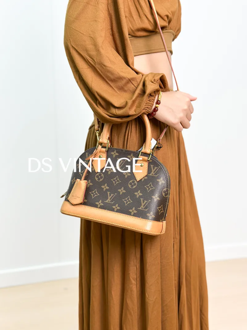 Louis Vuitton Crossbody Bag Alma BB Monogram PVCBB23.5 × 11.5 × 17.5 cm — on-model view 1 of 3