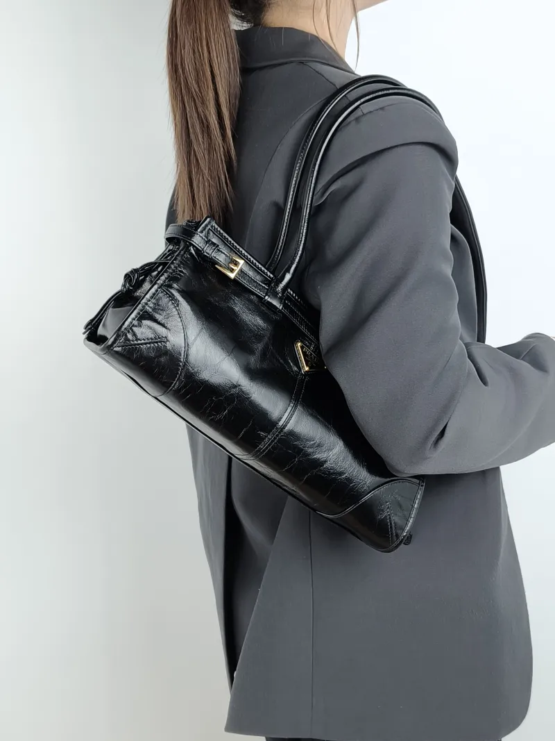 PRADA Shoulder Bag Bonnie Soft Lux Black Waxed Leather Medium 32 × 12 × 15.5 cm — on-model view 2 of 4