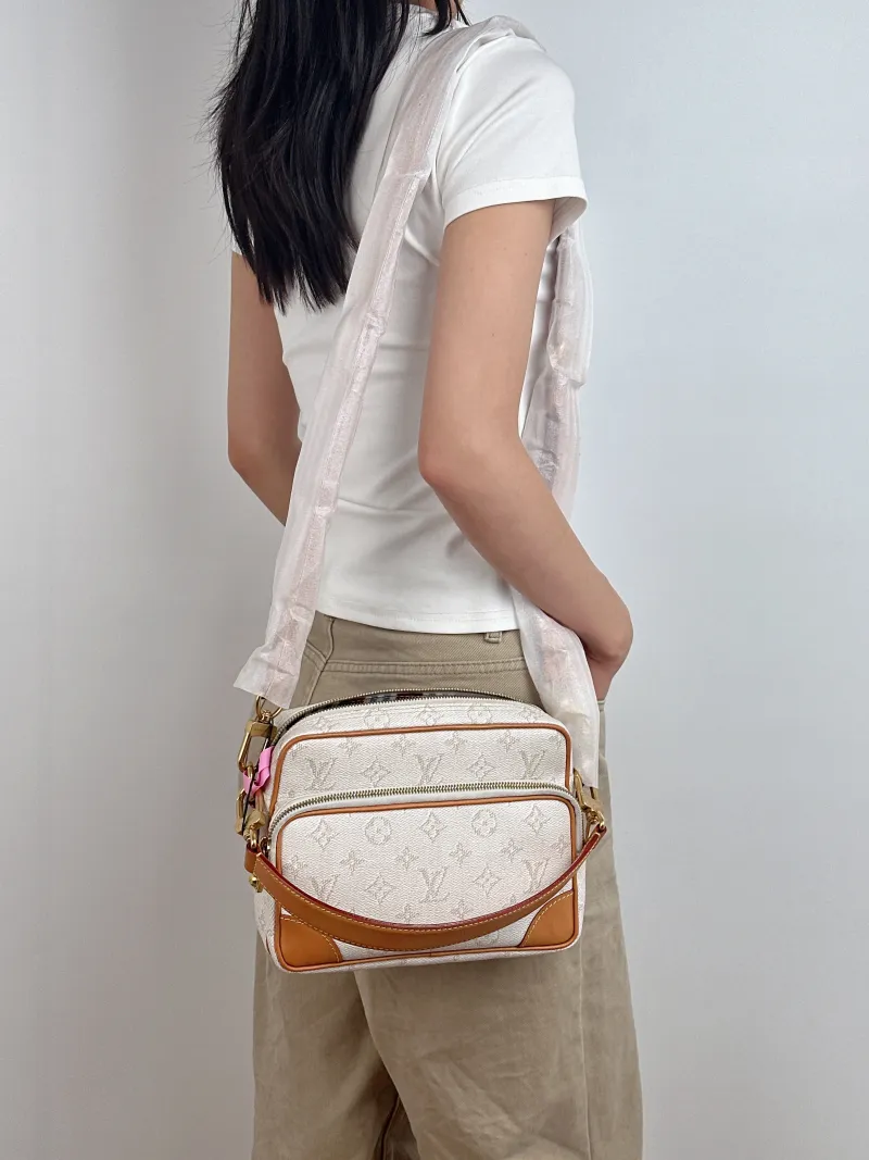 Louis Vuitton Crossbody Bag Nil Messenger Bag PVC One Size 25 × 11 × 17.5 cm — on-model view 1 of 3