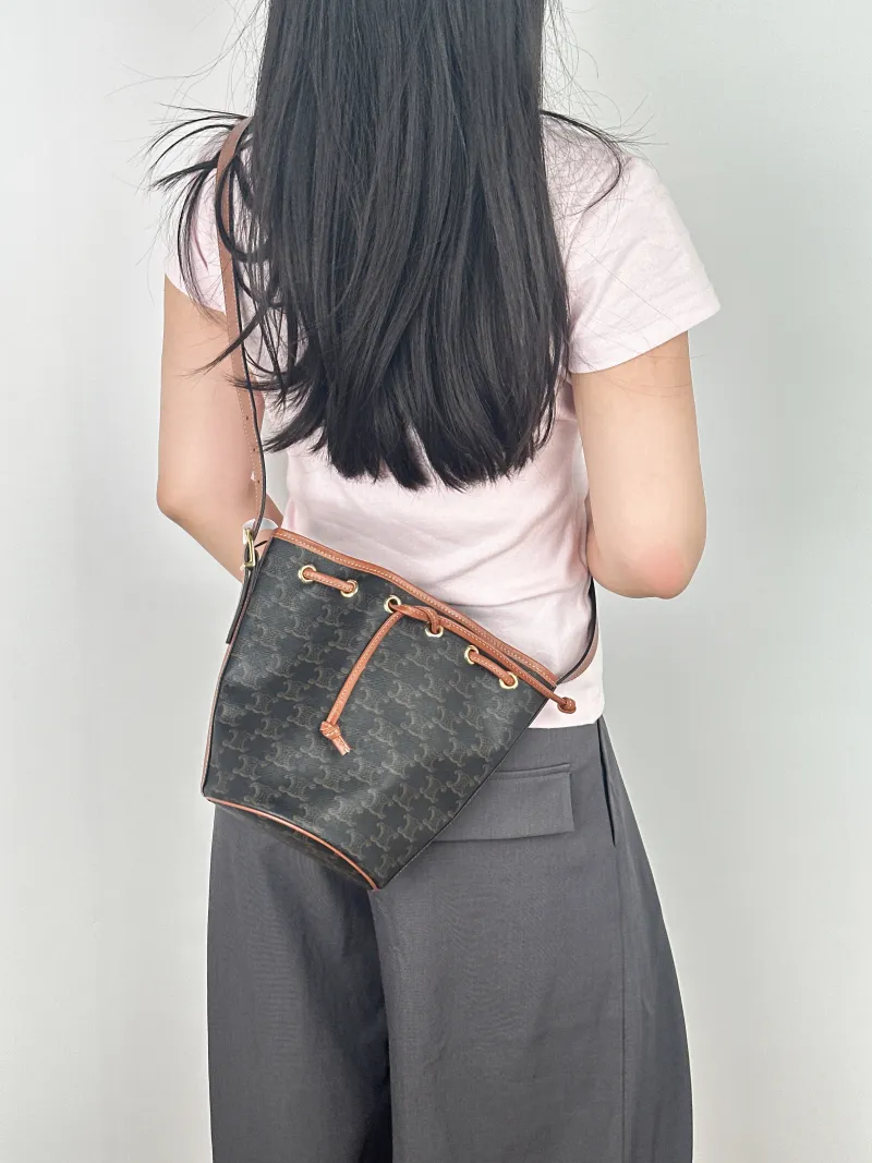 CELINE Crossbody Bag Triomphe Bucket Bag Monogram PVC Small14 × 14 × 21 cm — on-model view 2 of 2