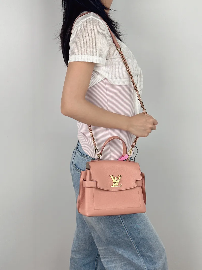 Louis Vuitton Top Handle Bag Lockme Ever Top Handle Bag Pink Calfskin Mini 23 × 10 × 17 cm — on-model view 2 of 3