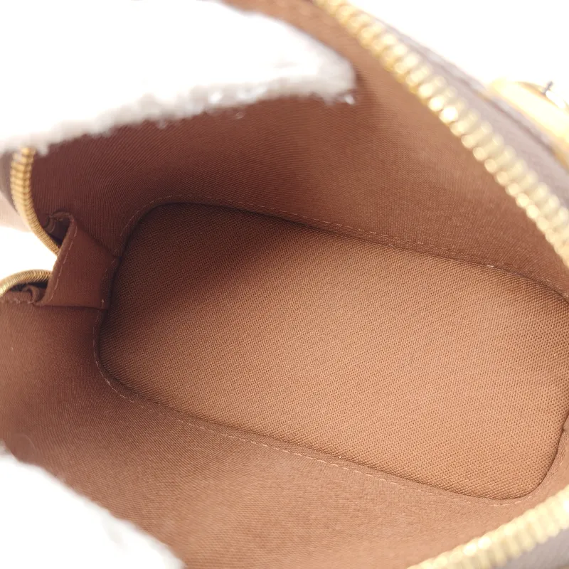 Louis Vuitton Crossbody Bag Alma Nano Monogram PVC nano 18 × 8 × 12 cm — detail view 9 of 10