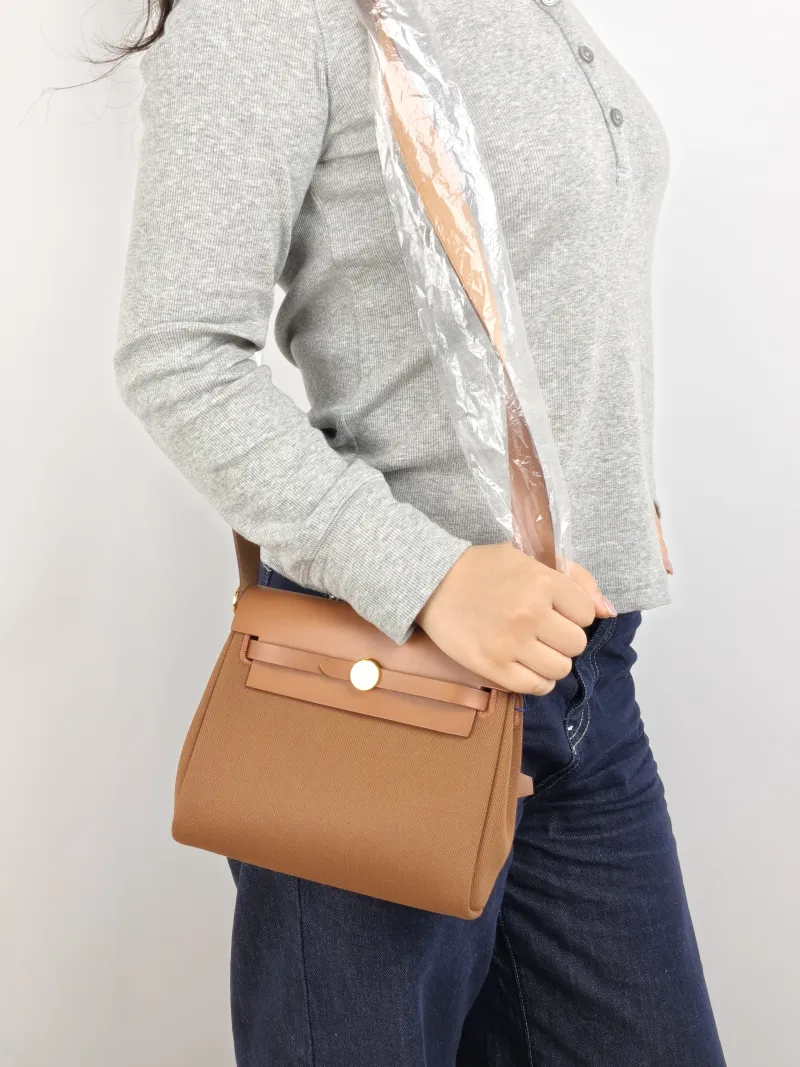 Hermès Crossbody Bag Herbag Zip 20 37 Brown Calfskin，Canvas Mini 20.5 × 7 × 16.5 cm G — on-model view 1 of 2