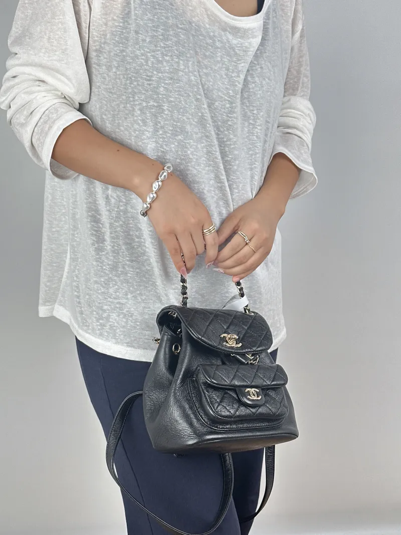 Chanel Backpack Duma Black Calfskin Small18 × 12 × 18.5 cm — on-model view 1 of 3